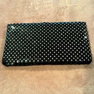 Black studded clutch